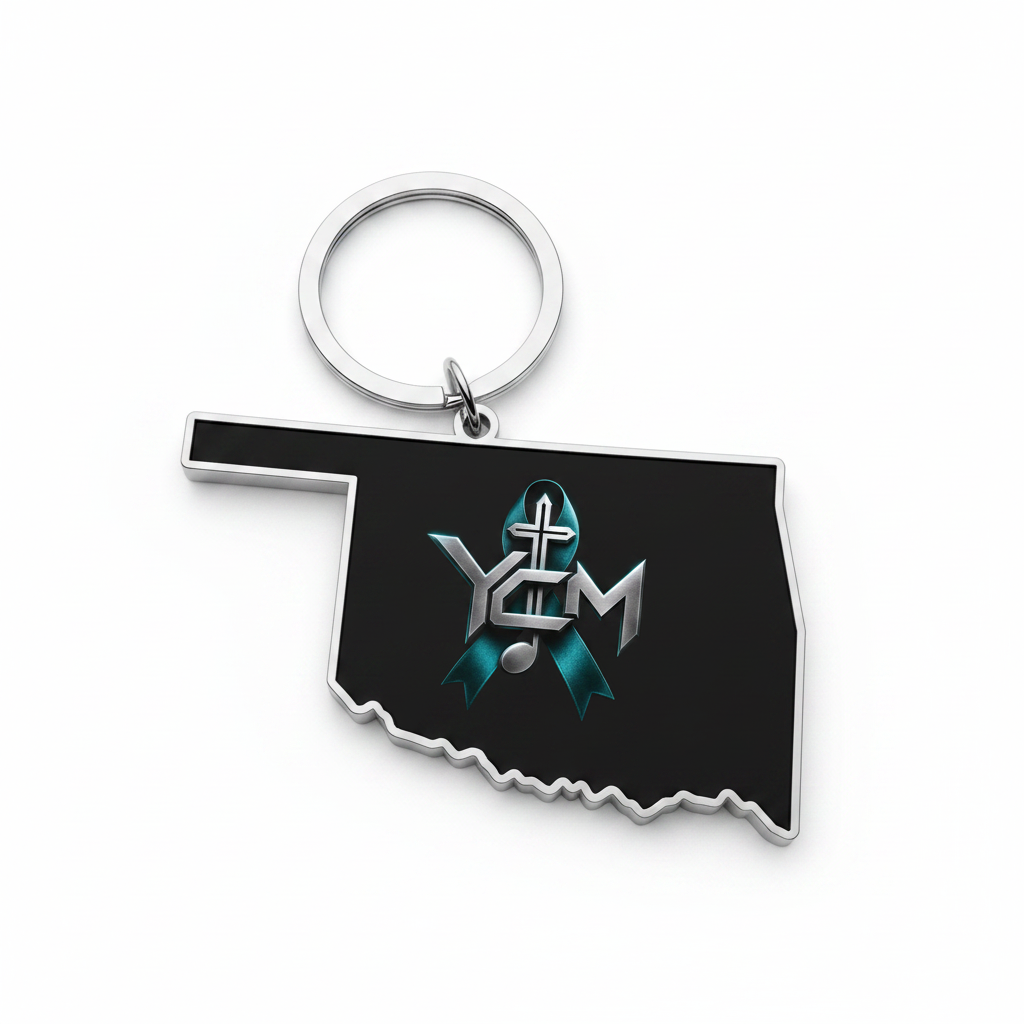 Oklahoma-shaped black enamel keychain with YCM logo
